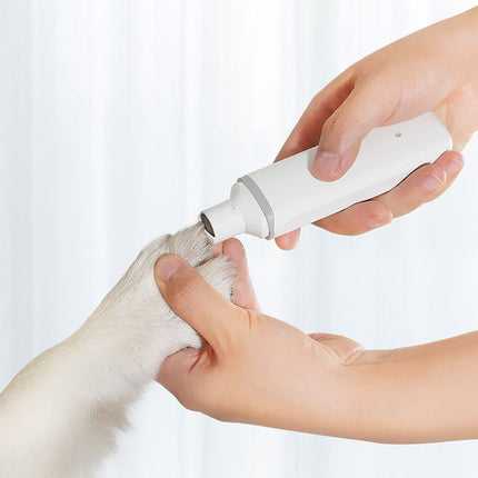 Electric pet nail polisher in white by Petpexi for cats and dogs, featuring low noise, low vibration, and rechargeable ABS design for safe nail smoothing

