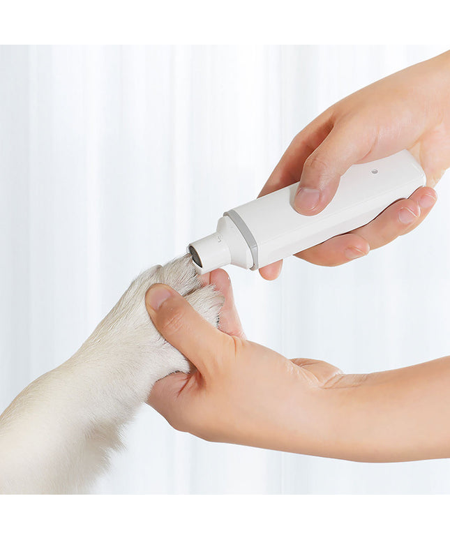 Electric pet nail polisher in white by Petpexi for cats and dogs, featuring low noise, low vibration, and rechargeable ABS design for safe nail smoothing

