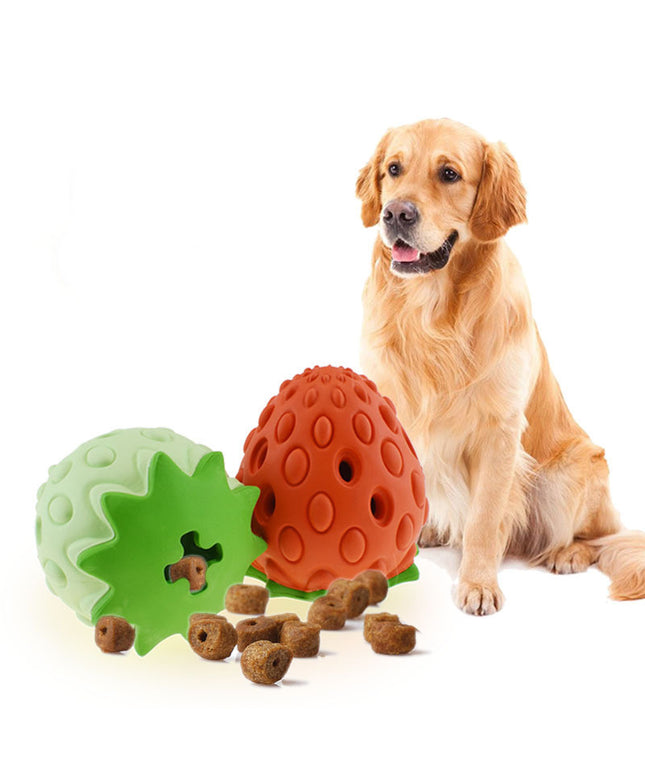 Red and green chew-resistant strawberry leak food ball for dogs and cats from www.petpexi.com, perfect for treat-dispensing fun.